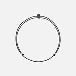 Zwilling Sternzeichen Armband – Feines Kristallarmband mit verstellbarem Band auf weißem Hintergrund.